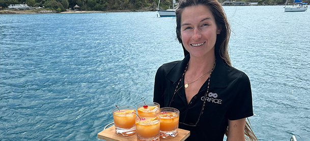 Captain Dani Andrews with drinks ready to go for guests