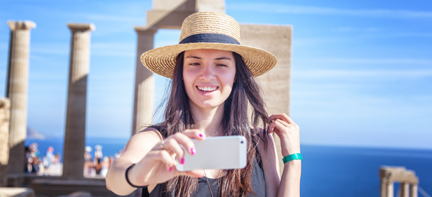 Woman taking a selfie in Greece