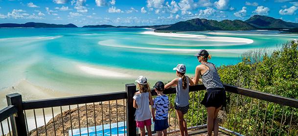 family looking out from top of a hill