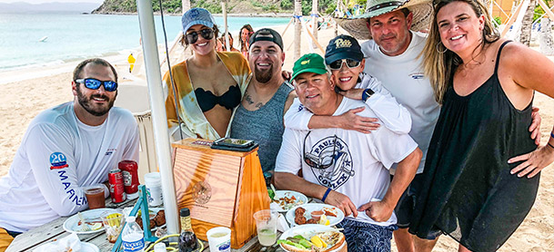 Group taking a picture at table with food