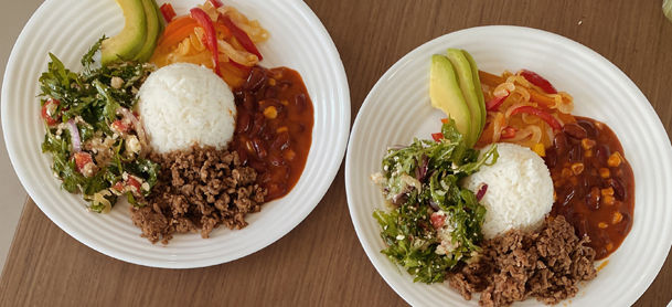 two plates of food sitting on a table