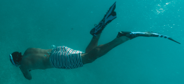 man snorkeling under water