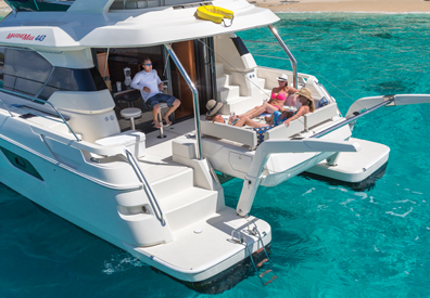 People relaxing aboard the MarineMax 443