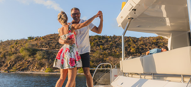 A couple dancing on a boat