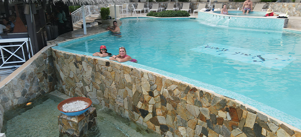 friends hanging out in a pool