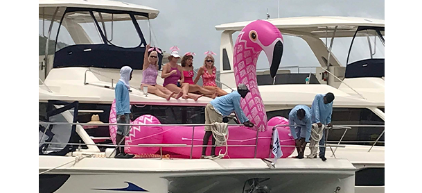 A pink flamingo float aboard a MarineMax Vacations power catamaran