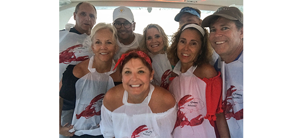 A group of people aboard a MarineMax Vacations power catamaran