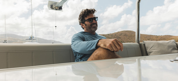 man sitting on a chair on a boat
