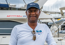 clarence malone standing in front of a marine max yacht