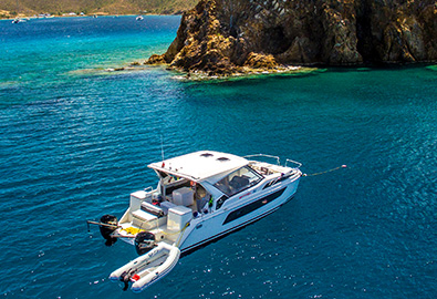 aquila power catamaran in open blue water in the bvi