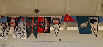 flags handing on wall of bar in BVI