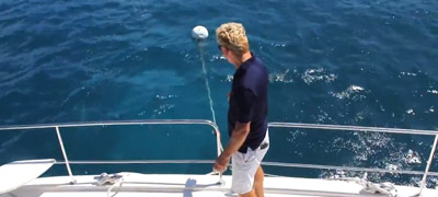 Man explaining how to pick up a mooring ball