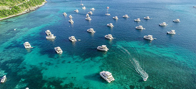 A lot of MarineMax Vacations Power Catamarans moored in the British Virgin Islands
