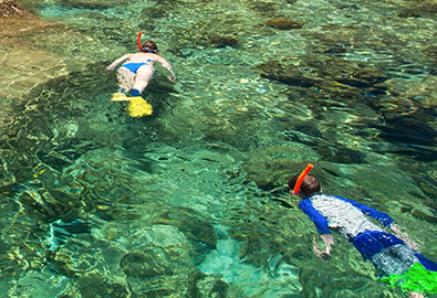 two people snorkeling