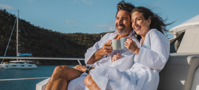 couple smiling and lounging on marinemax charter