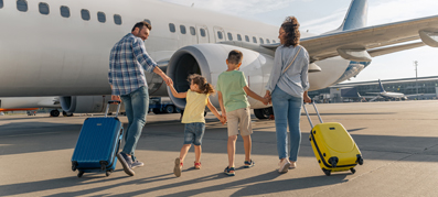 family walking onto plane