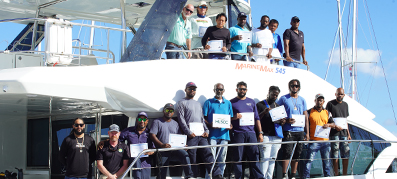 marinemax vacations team members with their certificates