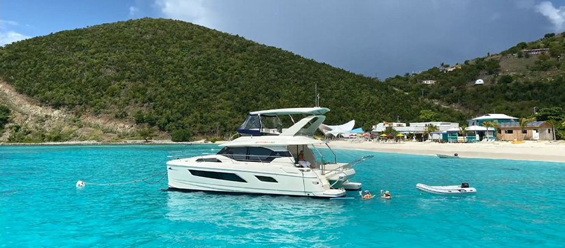 An Aquila power catamaran in front of the Soggy Dollar in the British Virgin Islands