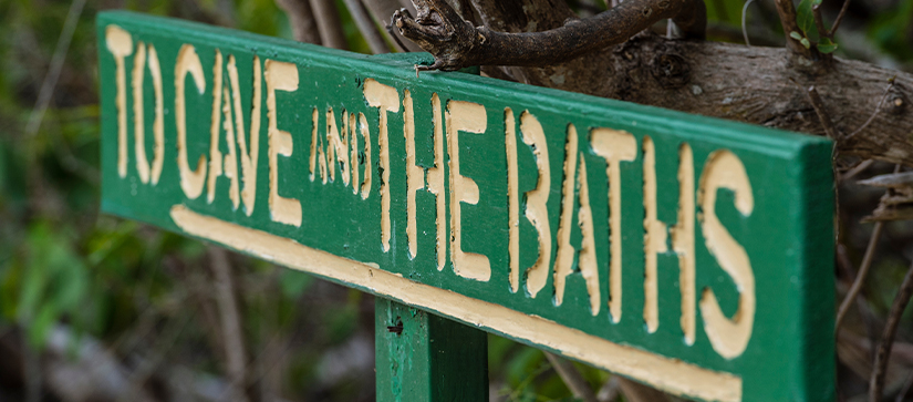 A sign saying to Cave and the Baths