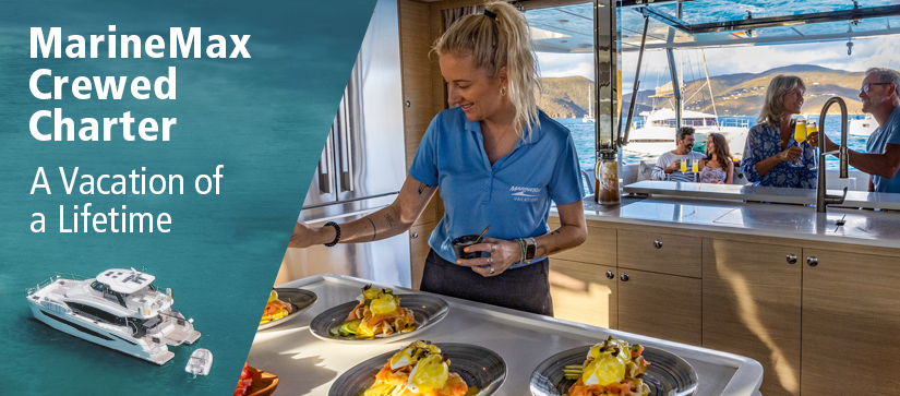woman plating food with charter guests in the background