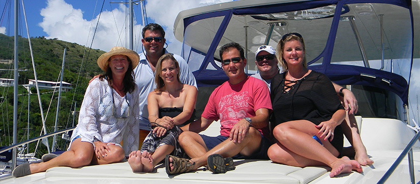 Group lounging on flybridge of Power Catamaran.