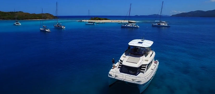 boats anchored around islands