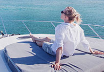 woman sitting on the boat deck