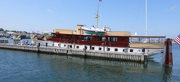 A red ferry boat sits docked in Nantucket
