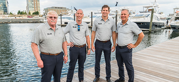 yacht brokerage team on the docks