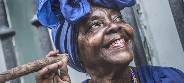 woman wearing purple smoking cigar