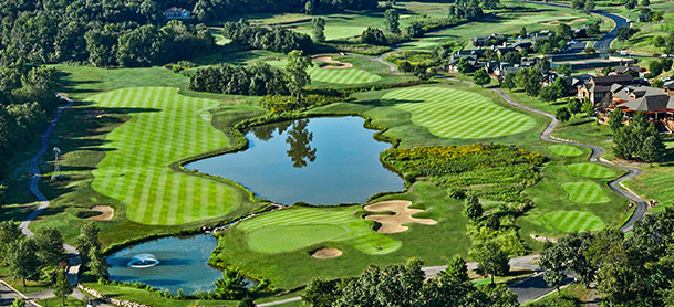 Aerial shot of a golf course with two bodies of water in the middle