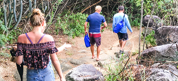 People walking in forest sandy area