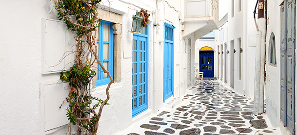 Stone walk way lined with blue windows