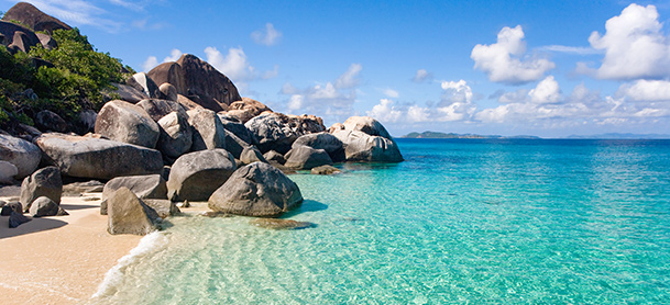 Large rocks near crystal clear water