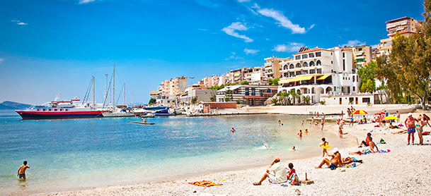 Beach scene with buildings in the distance