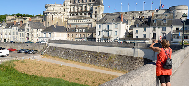 Person taking photo of city buildings