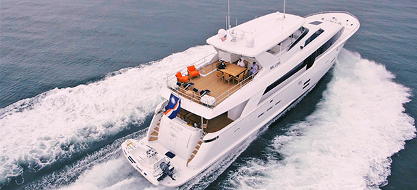 Large white yacht running