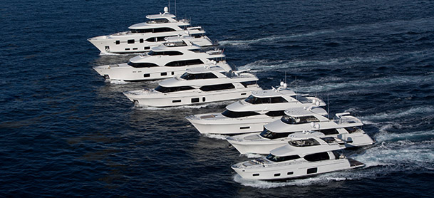 group of large yachts running together