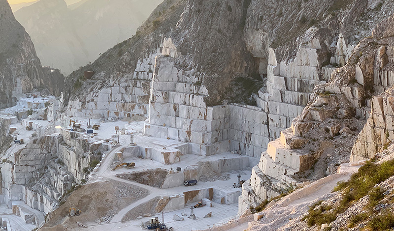 a view of rocky cliffs in the mountains of italy
