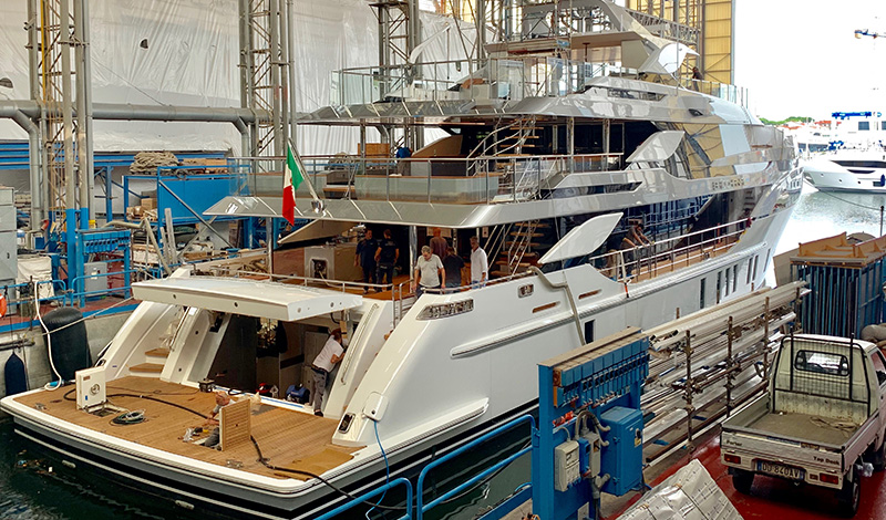 a yacht under construction in a factory in italy