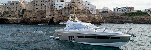 an azimut yacht in water close to an island