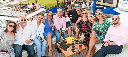 group of people sitting on a yacht during event