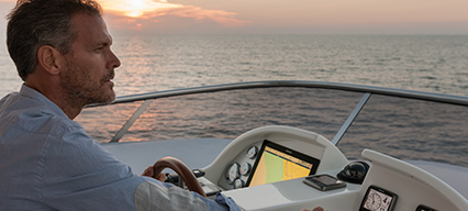 a man driving an azimut yacht