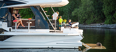 family enjoying an anchored yacht