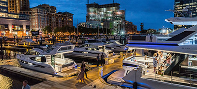 yachts along dock at night