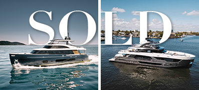 Split image of two luxurious yachts on blue water, one on the left, one on the right. The word "SOLD" overlays the center in large white letters.