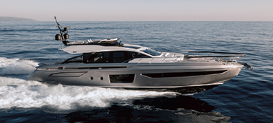 A white and silver Azimut S8 sails across the water
