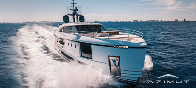 Luxurious white Azimut yacht cruising through calm blue waters under a clear sky, leaving a foamy trail.