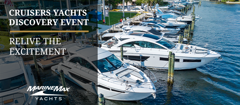 Cruisers yachts sitting at a dock