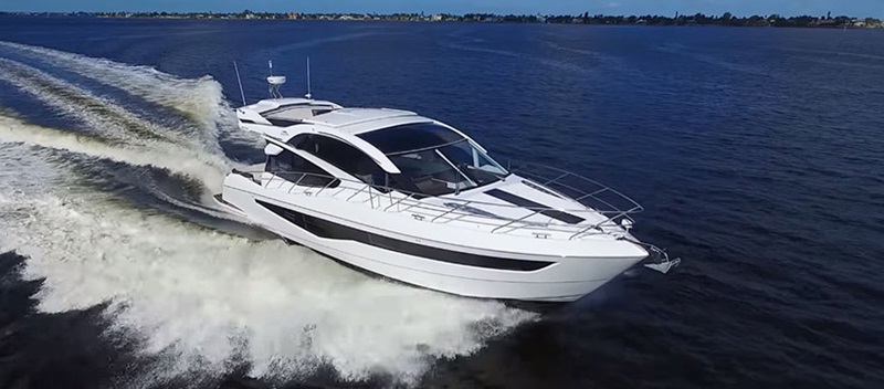 Galeon 560 Skydeck cruising through the water 